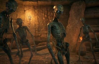 Feature image for our Hogwarts Legacy Unforgivable Curses guide. It shows several undead creatures in some of the Hogwarts Legacy catacombs.