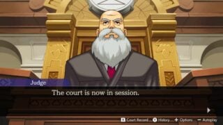 The judge sits at his desk in Apollo Justice: Ace Attorney Trilogy.