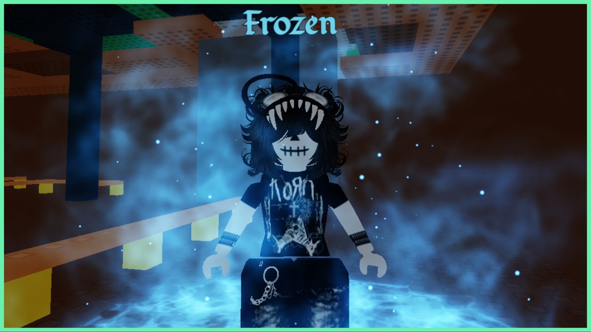 The image shows my avatar with the Frozen aura which shrouds her in a blue frosty air like element with blue sparkles. My avatar is facing directly into the camera and is stood inside a dark room
