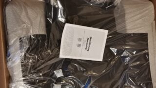 Image for our Flexispot Swivel Rocker Recliner Lotus review. It shows the recliner in a box, ready for assembly.