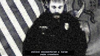 Image showing a screenshot form the intro of Mulberry County. It shows the grainy, black and white image of what appears to be a police officer making a press statement in front of the US flag. The dialogue underneath reads 'police encountered a large pale creature'. 