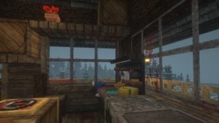 A screenshot from Minecraft's Dread Reborn modpack, showing the inside of a player home inside a lookout tower. There's an ammo bench set up just ahead, and several red stains on the windows and ceiling. A screenshot from Minecraft's Dread Reborn modpack, showing the inside of a player home inside a lookout tower. There's an ammo bench set up just ahead, and several red stains on the windows and ceiling.