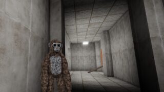 Screenshot from Ear Game, showing a player character as a brown ape standing in a shadowy hallway in Ape Storage. Screenshot from Ear Game, showing a player character as a brown ape standing in a shadowy hallway in Ape Storage.