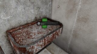 Screenshot form Ear Game showing an item dispensed from the shop sitting on a rusty tray. Screenshot form Ear Game showing an item dispensed from the shop sitting on a rusty tray.