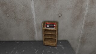 An in-game screenshot showing the Level 2 Keycard, sitting in a wooden holder on a desk. An in-game screenshot showing the Level 2 Keycard, sitting in a wooden holder on a desk.